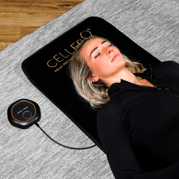 Woman lying on the CELLER8 Full Body PEMF Mat